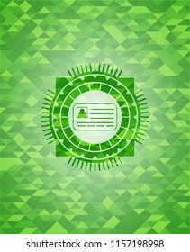 identification card icon inside green mosaic emblem