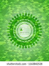 identification card icon inside green mosaic emblem
