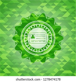 identification card icon inside green mosaic emblem