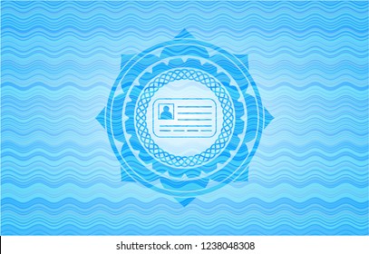 identification card icon inside light blue water style emblem.