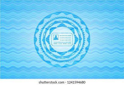 identification card icon inside light blue water wave style badge.