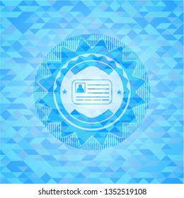 identification card icon inside light blue emblem with triangle mosaic background