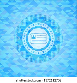 identification card icon inside light blue mosaic emblem