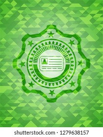 identification card icon inside realistic green mosaic emblem