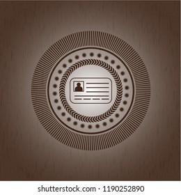 identification card icon inside retro style wood emblem