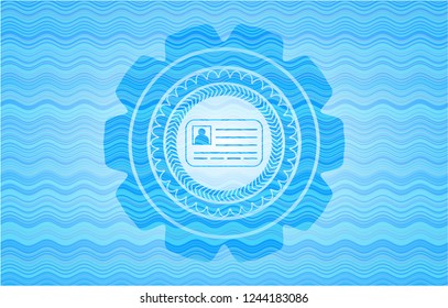 identification card icon inside sky blue water wave badge.