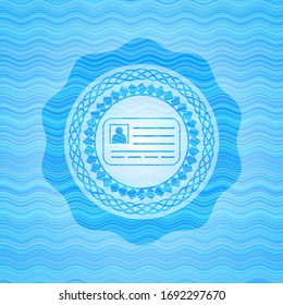 identification card icon inside water concept emblem.