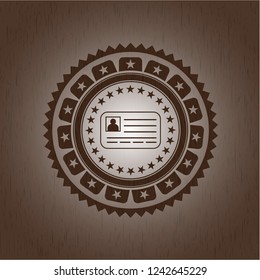 identification card icon inside wooden emblem. Vintage.