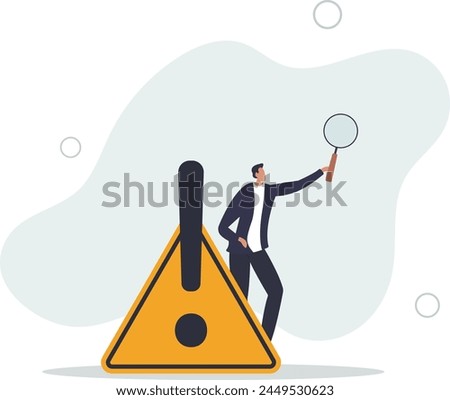 identify risk or critical failure concept, businessman with magnifier monitor and investigate incident with exclamation attention sign.