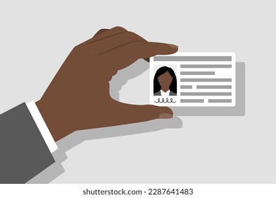 Identity card with personal information in hand of woman. Concept of identification document of person, citizenship and migration issues