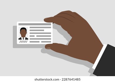 Identity card with personal information in hand of man. Concept of identification document of person, citizenship and migration issues