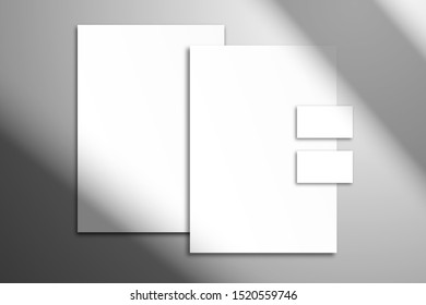 Сorporate identity mockup with shadow from the window.  Letterhead, folder and  business cards