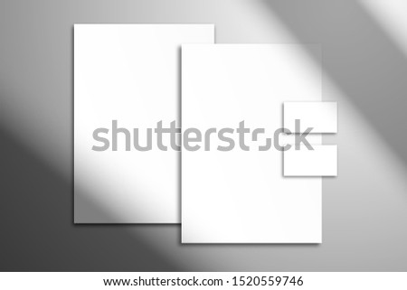 Сorporate identity mockup with shadow from the window.  Letterhead, folder and  business cards