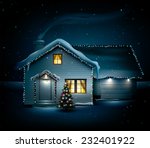 Idyllic family house on idyllic snowy Christmas night