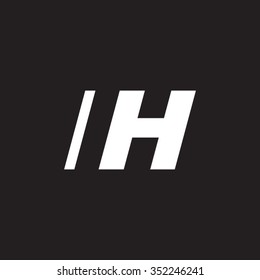 IH negative space letter logo black background