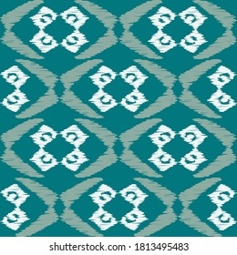 Ikat. Abstract ethnic pattern on fabric in Indonesia and other Asian countries. Seamless background. Vector illustration for web design or print.