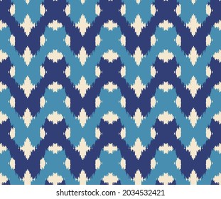 Ikat art seamless pattern. Tie-dye background. Traditional classic wallpaper. Folk style for fashion, interior, home decoration. Vector.