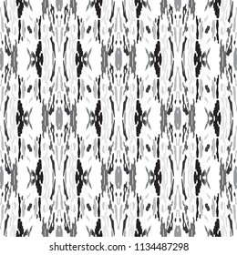 Ikat batik print in modern style, shibori fabric design. Tribal ethnic seamless pattern. Vintage endless repeat ornament. Traditional folk ikat texture. Vector watercolor geometric background.