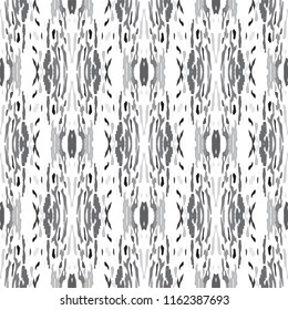 Ikat batik print in modern style, shibori fabric design. Tribal ethnic seamless pattern. Vintage endless repeat ornament. Traditional folk ikat texture. Vector watercolor geometric background.