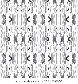 Ikat batik print in modern style, shibori fabric design. Tribal ethnic seamless pattern. Vintage endless repeat ornament. Traditional folk ikat texture. Vector watercolor geometric background.