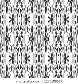 Ikat batik print in modern style, shibori fabric design. Tribal ethnic seamless pattern. Vintage endless repeat ornament. Traditional folk ikat texture. Vector watercolor geometric background.