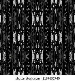 Ikat batik print in modern style, shibori fabric design. Tribal ethnic seamless pattern. Vintage endless repeat ornament. Traditional folk ikat texture. Vector watercolor geometric background.