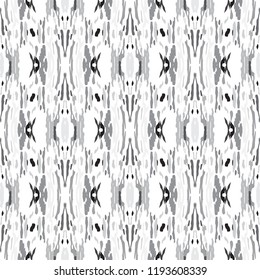 Ikat batik print in modern style, shibori fabric design. Tribal ethnic seamless pattern. Vintage endless repeat ornament. Traditional folk ikat texture. Vector watercolor geometric background.