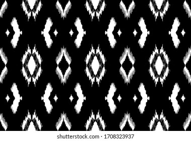 Ikat border. Geometric folk ornament. Tribal vector texture. Seamless striped pattern in Aztec style. Ethnic embroidery. Indian, Scandinavian, Gypsy, Mexican, African rug.