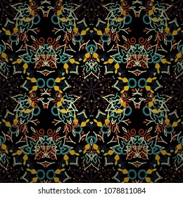 Ikat damask seamless pattern background tile on black background in beige, yellow and green colors.