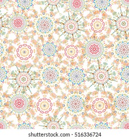 Ikat damask seamless pattern background tile on white background in red, orange and green colors.