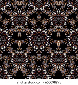 Ikat damask seamless pattern background tile on black background in pink and orange colors.