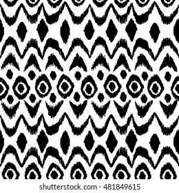 Ikat damask seamless pattern. Black diamonds on a white background. Vintage vector illustration.