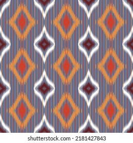 Ikat diamond (rhombus) seamless pattern. tie dye Shibori print with stripes and chevron. Ink textured ๋Japanese background. Ethnic fabric. Bohemian fashion.