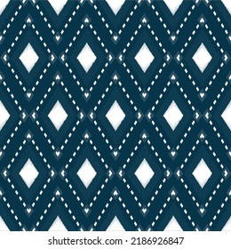 Ikat ethnic background vector. Seamless diamond pattern of white geometric shapes on navy blue background. Design for carpet, wallpaper, background, wrapping,clothing, fabric.