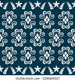 Ikat ethnic background vector. Seamless pattern of abstract diamonds shapes with leaves and flower. Design for carpet, wallpaper, background, wrapping,clothing, fabric.