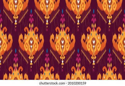 Ikat ethnic design abstract background. Seamless pattern in tribal,folk embroidery,chevron art design. Aztec geometric art ornament print.Design for carpet, wallpaper, clothing,wrapping,fabric,cover