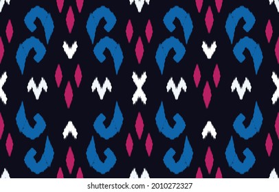 Ikat ethnic design abstract background. Seamless pattern in tribal,folk embroidery,chevron art design. Aztec geometric art ornament print.Design for carpet, wallpaper, clothing,wrapping,fabric,cover