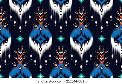 Ikat diseño étnico de fondo abstracto. Patrón sin foco en las tribus,
bordado folclórico, diseño de arte chevron. Impresión de ornamentos de arte geométrico azteca.
Diseño de alfombras, tapicería