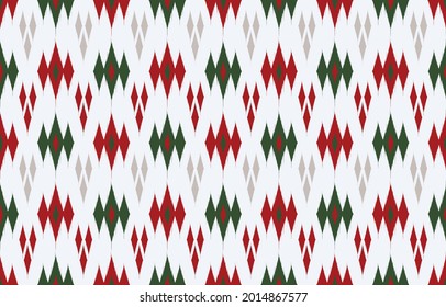 Ikat ethnic design background. Seamless pattern in tribal, folk embroidery red green christmas tones. Aztec geometric art ornament print.Design for carpet, wallpaper, clothing, wrapping, fabric, cover