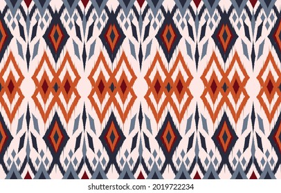 Ikat-Hintergrund für ethnisches Design. Nahtlose Muster in Stamal, Folk Stickereikunst in blau orangefarbenem Chevron. Aztekische geometrische Kunstverzierungen.Design für Teppiche, Tapeten, Kleidung, Umhüllung, Stoff, Deckel