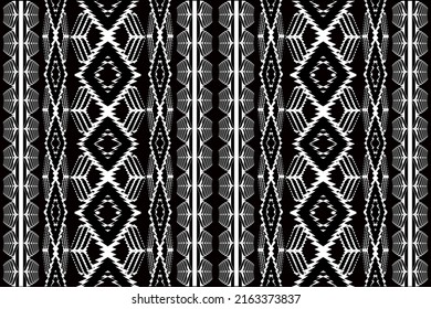 Antecedentes de diseño étnico Ikat. Patrón sin foco en el arte de chevron vintage tribal de bordado folclórico. Dibujo de ornamento de arte geométrico azteca.Diseño de alfombras, papel pintado, ropa, envoltura, tela, cubierta negro