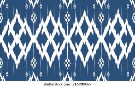 Ikat ethnic design background. Seamless pattern in tribal, folk embroidery vintage chevron art. Aztec geometric art ornament print. Design for carpet, wallpaper, clothing, wrapping, fabric, cover, rug