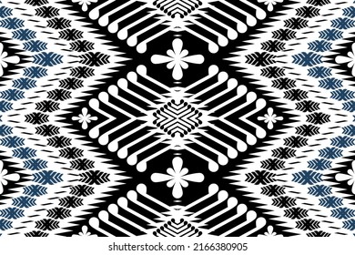Ikat ethnic design background. Seamless pattern in tribal, folk embroidery vintage chevron art. Aztec geometric art ornament print. Design for carpet, wallpaper, clothing, wrapping, fabric, cover, rug