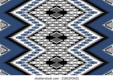 Ikat ethnic design background. Seamless pattern in tribal, folk embroidery vintage chevron art. Aztec geometric art ornament print. Design for carpet, wallpaper, clothing, wrapping, fabric, cover, rug