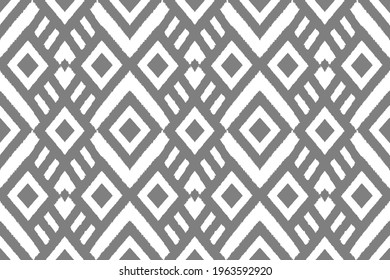 Ikat ethnic Indian seamless pattern design. Aztec fabric carpet mandala ornament boho native chevron textile wallpaper decoration. Geometric texture vector illustrations background .