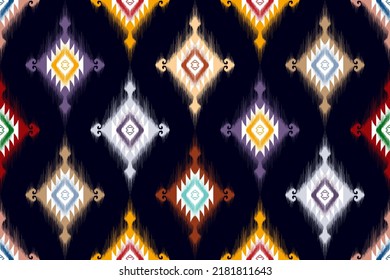 El motivo étnico de Ikat es un diseño de patrones sin fisuras. Moqueta de tela azteca mandala adornos de decoración textil papel tapiz. Nacimiento de boho tribal de origen étnico afroamericano tradicional bordado fondo vectorial 