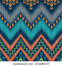 Ikat ethnic pattern. Dark blue, orange and green glow colors. Traditional fabric in tribal Turkey African Indian Asian. Ethnic geometric fabric textile vector illustration embroidery style.