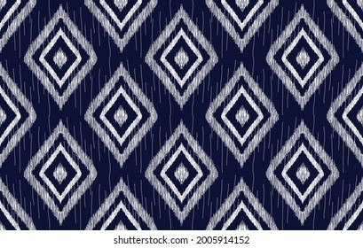 Ikat ethnic pattern seamless design. Aztec fabric carpet mandala ornament native tribal textile decoration wallpaper. Geometric texture traditional embroidery vector illustrations background.