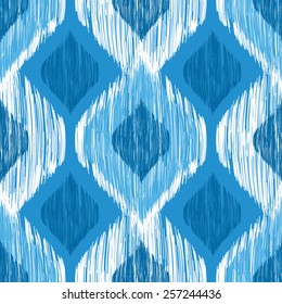 Ikat ethnic seamless pattern in blue and white colors