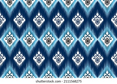 Ikat ethnic seamless pattern design. Aztec fabric carpet mandala ornament native boho chevron textile decoration wallpaper. Tribal turkey African Indian traditional embroidery vector background 